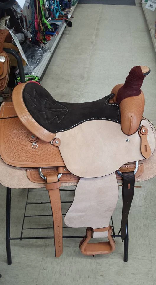 A western saddle displayed inside Baker Feed's tack department.